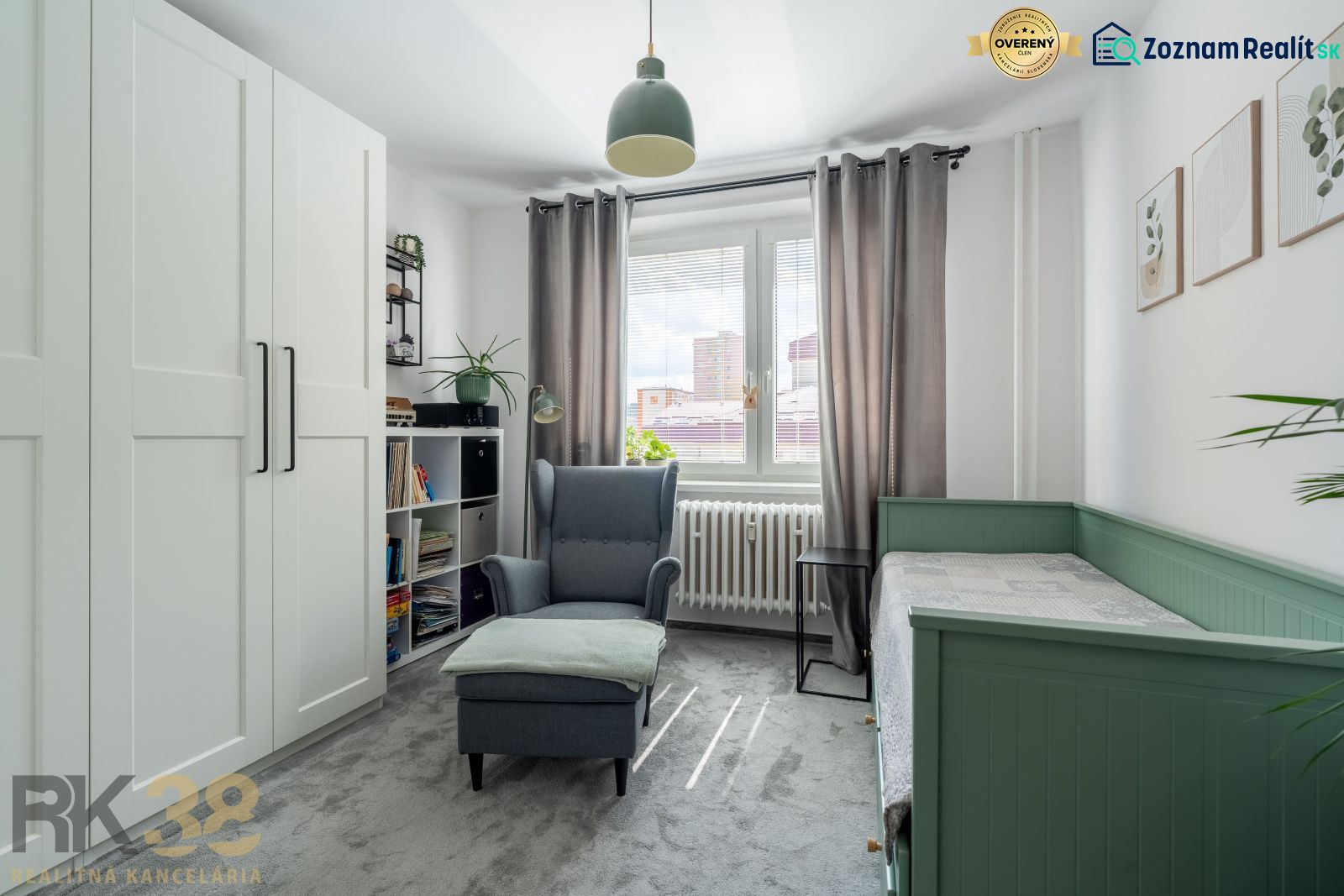 A bright room with a chair, bed, wardrobe, and decorations in a 3-room apartment.