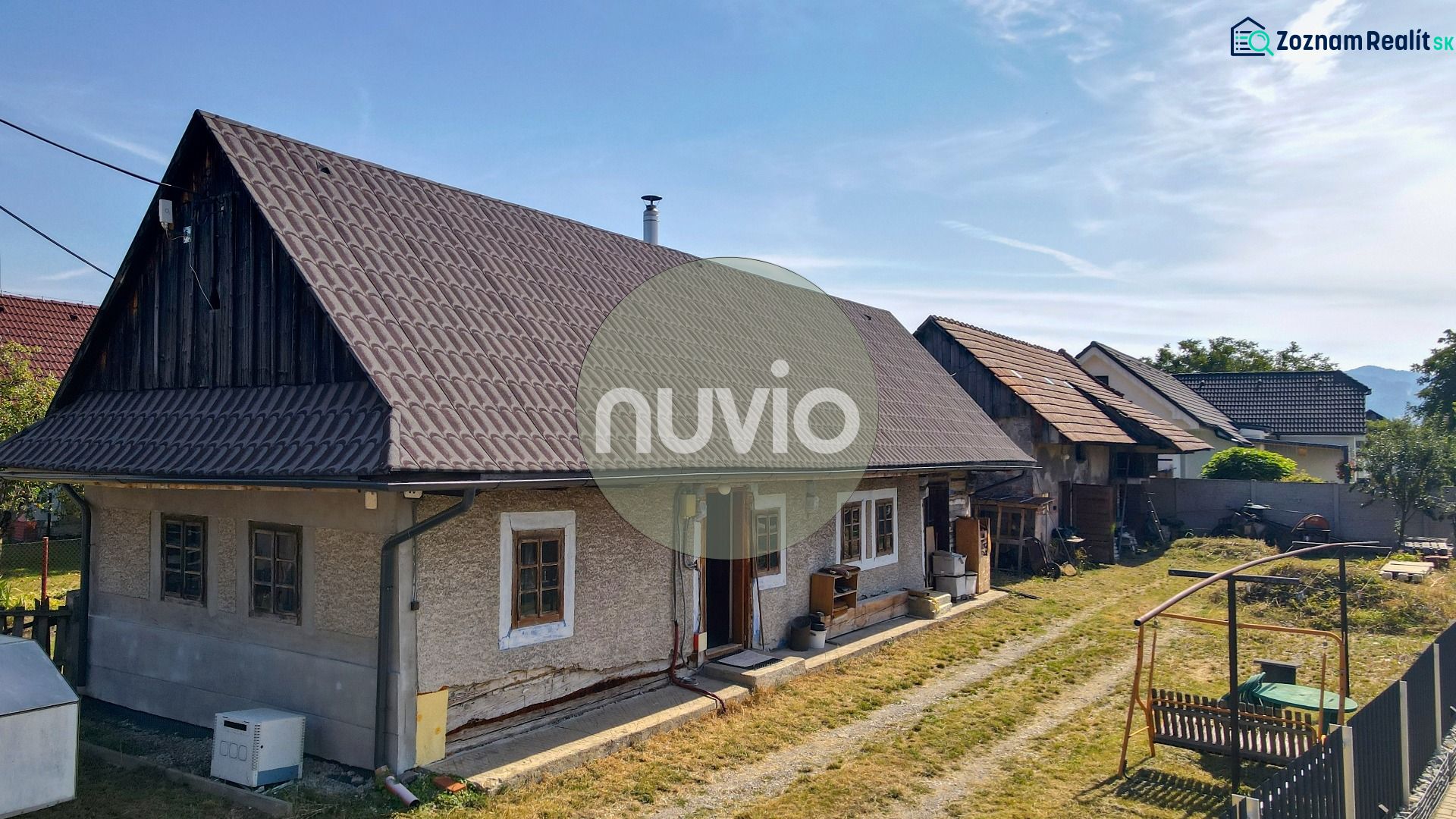 A family house in Žabokreky with a large garden and a traditional roof.