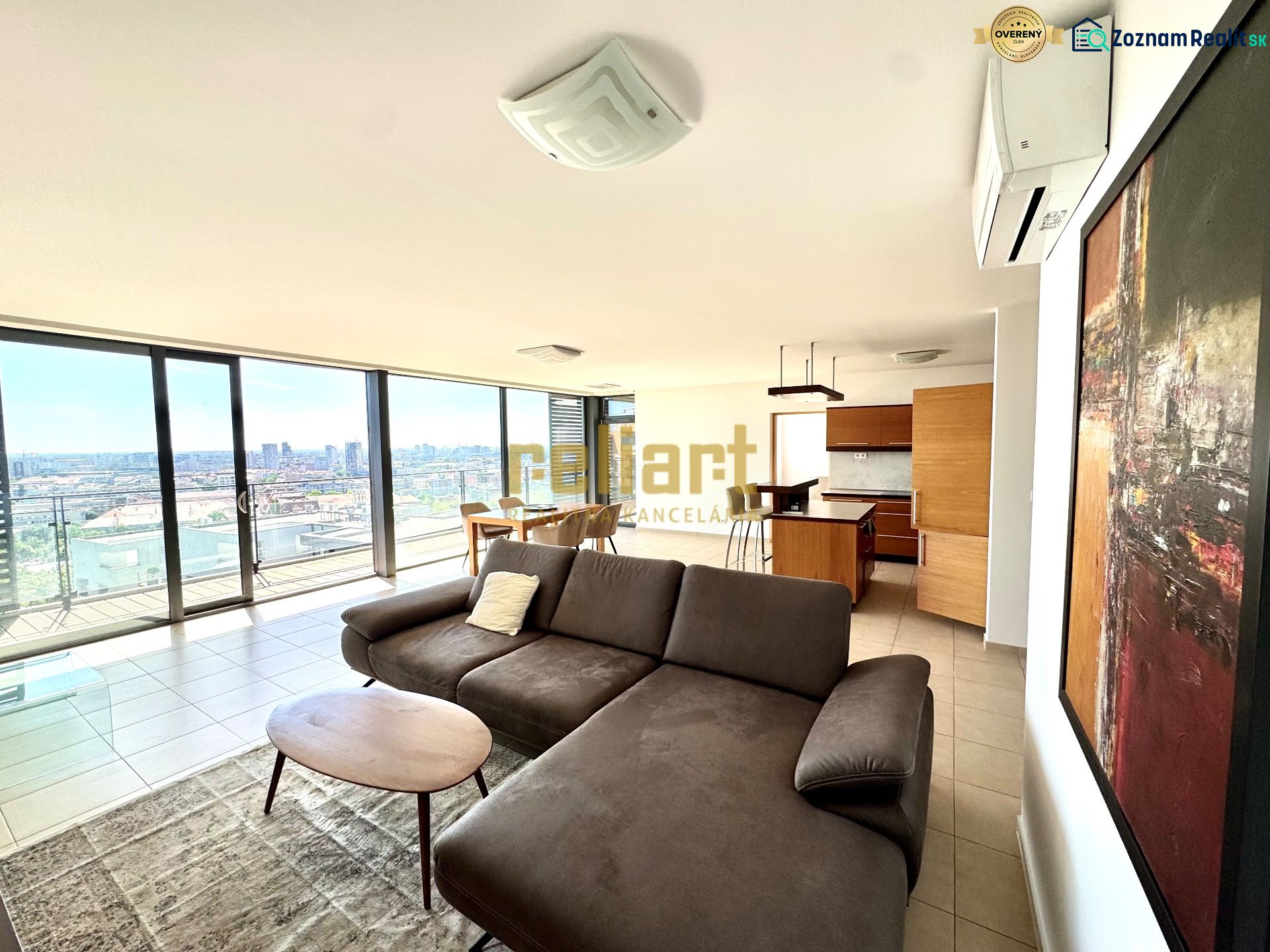 A spacious living area in a 4-room apartment with large windows and a view of the city.