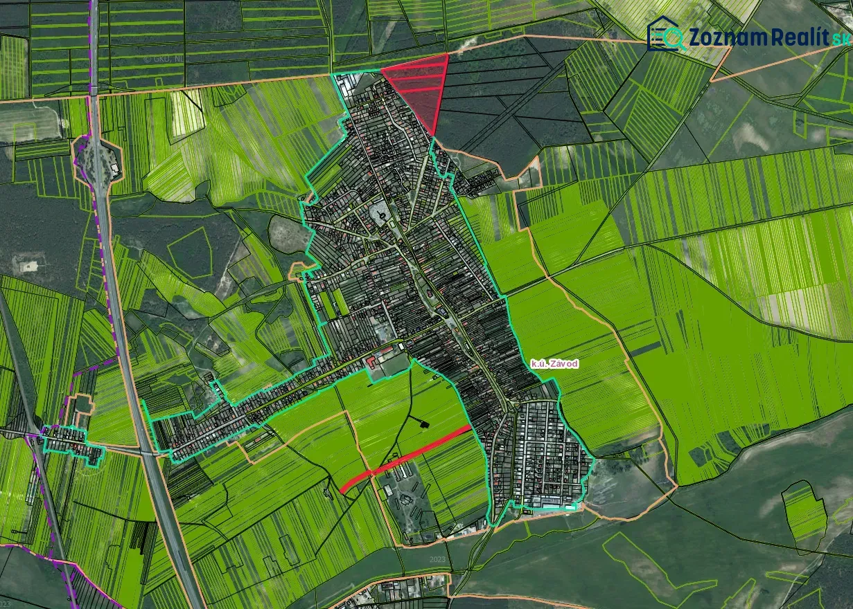 Aerial view of agricultural and forest land in Závod with paved roads.
