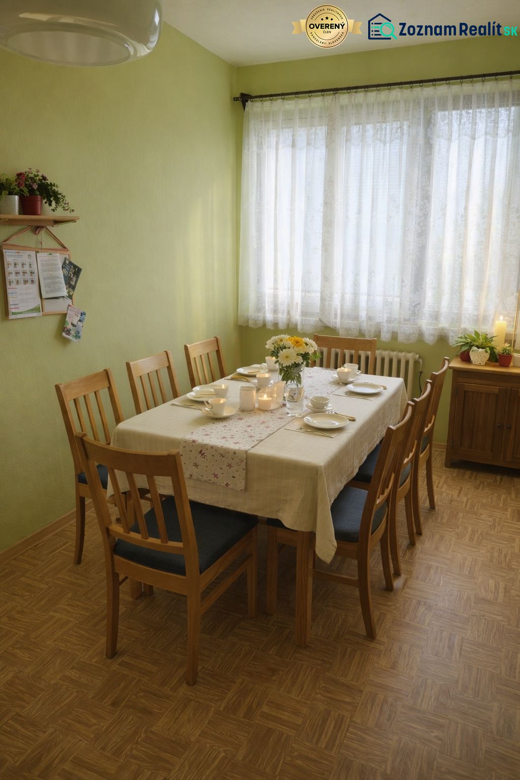 A dining room in a family house with a set table and a wooden decor floor.