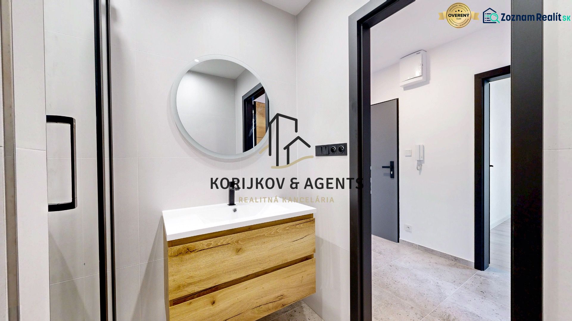 A bathroom with a shower and wooden decor in a 3-room apartment.