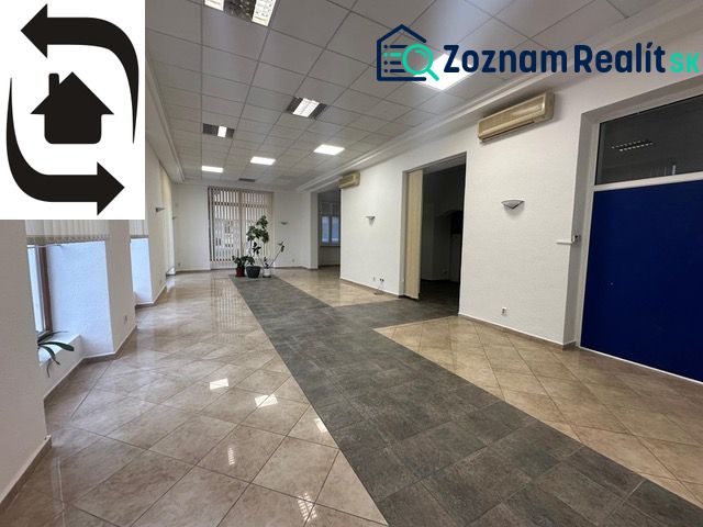 Spacious commercial premises with tiles and office partitions.
