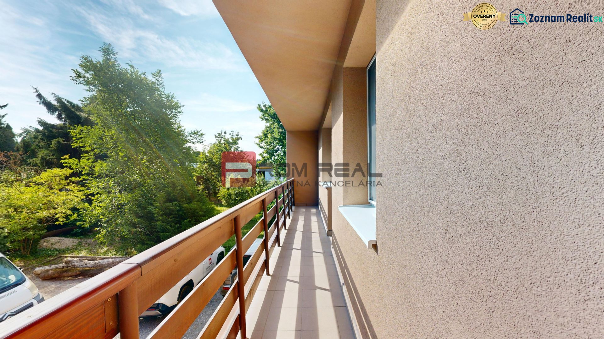Balcony of a 4-room apartment on Moyzesova Street in Pezinok with a view of greenery.