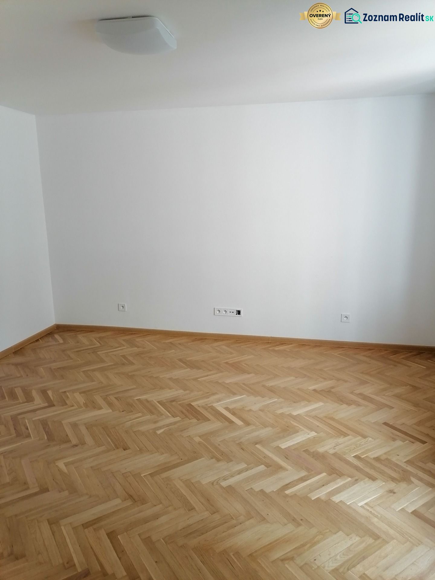 An empty room with wooden floor decor in a two-room apartment.