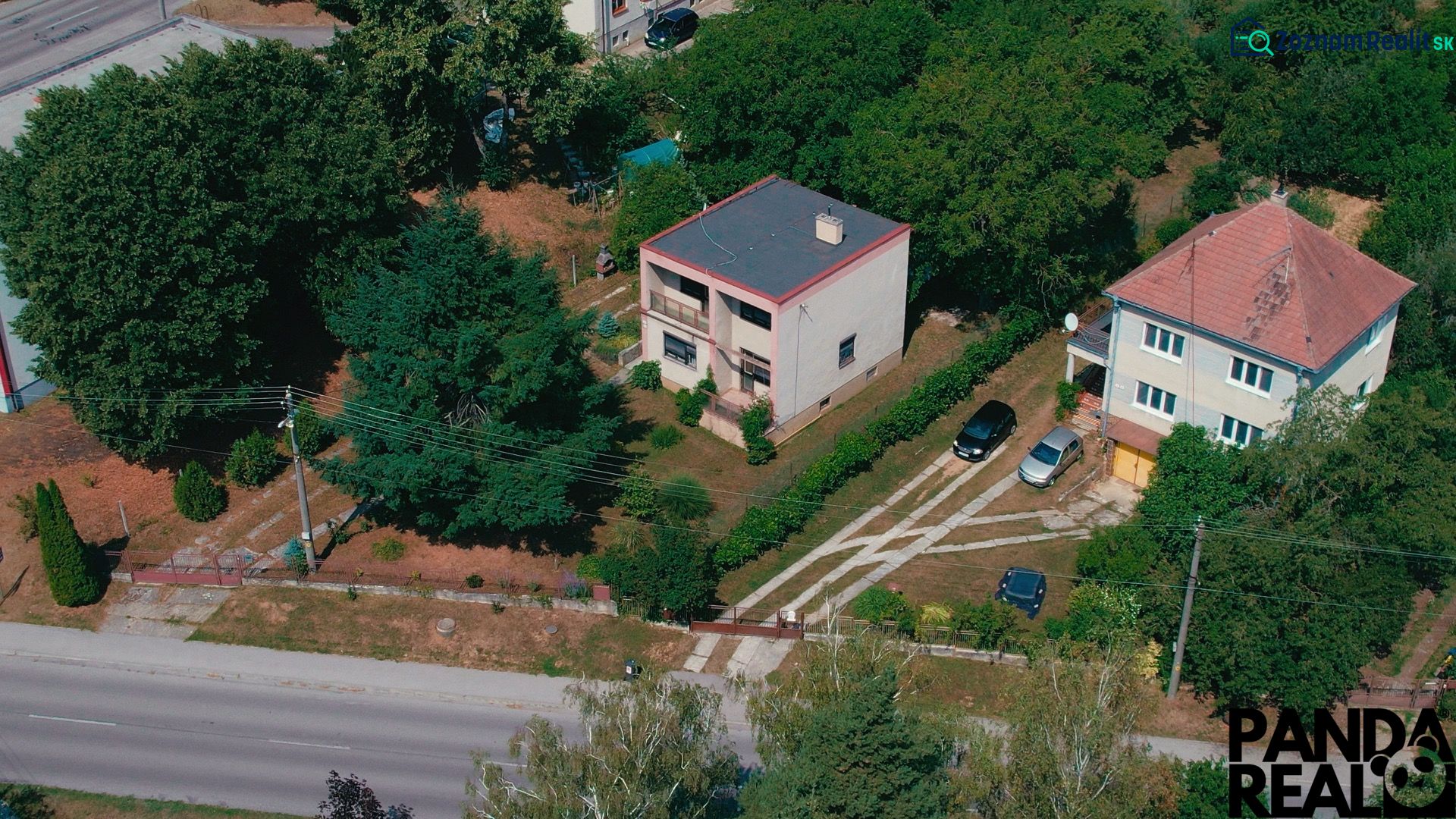 Aerial view of family houses surrounded by greenery on Nemečkovská Road in Prašice.