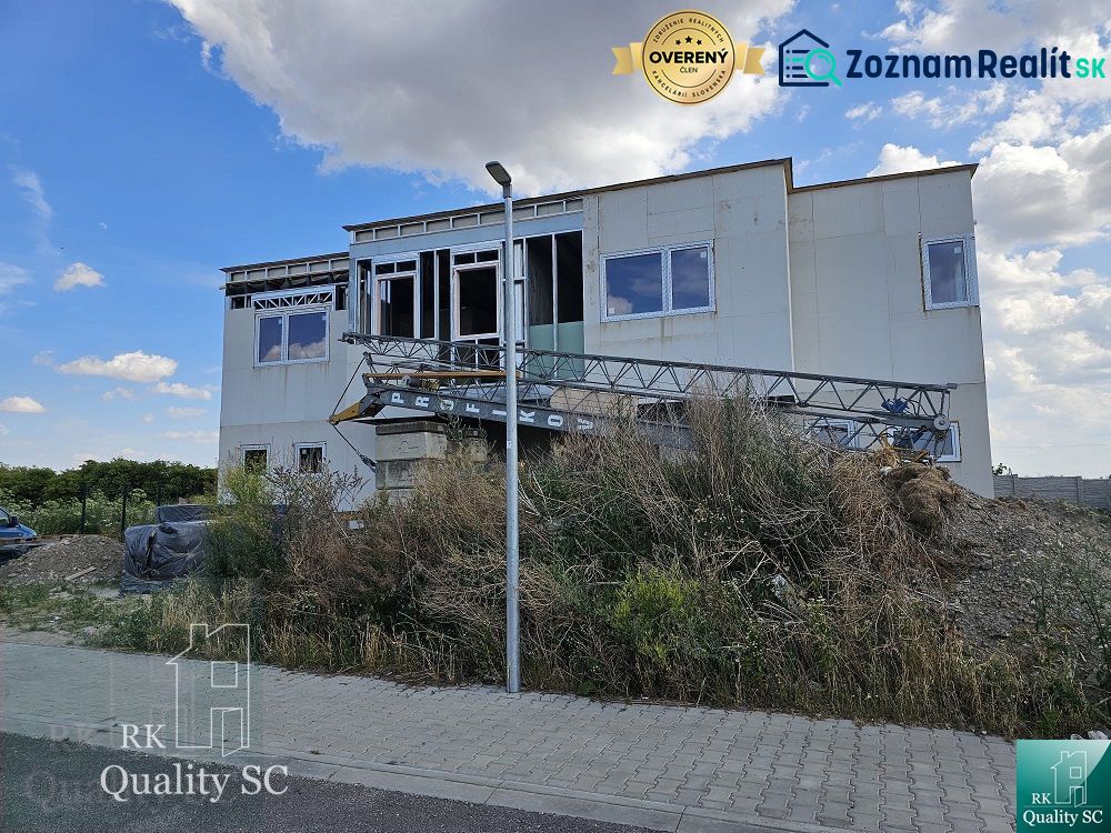 A family house on Lichnerova Street in Senec, under construction with building materials.