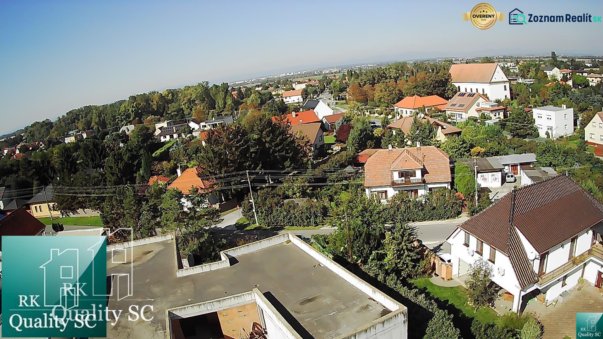 An aerial view of family houses in Kráľová pri Senci - Záhumenská, surrounded by greenery.