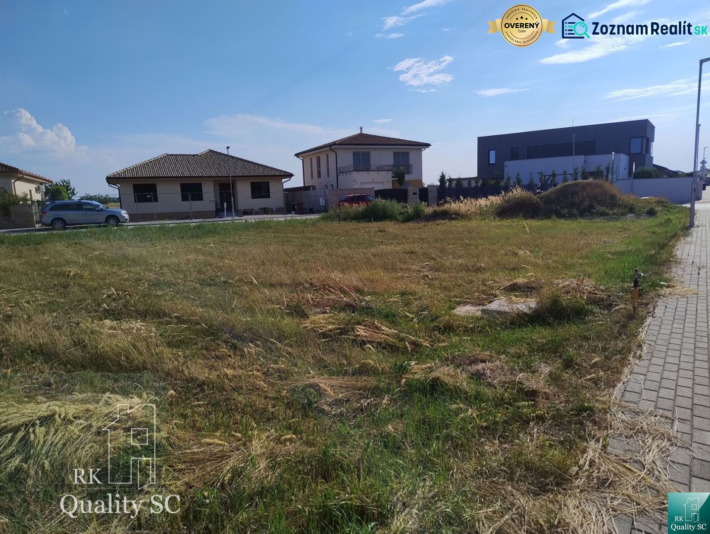 A residential building plot in Senec, surrounded by family houses.