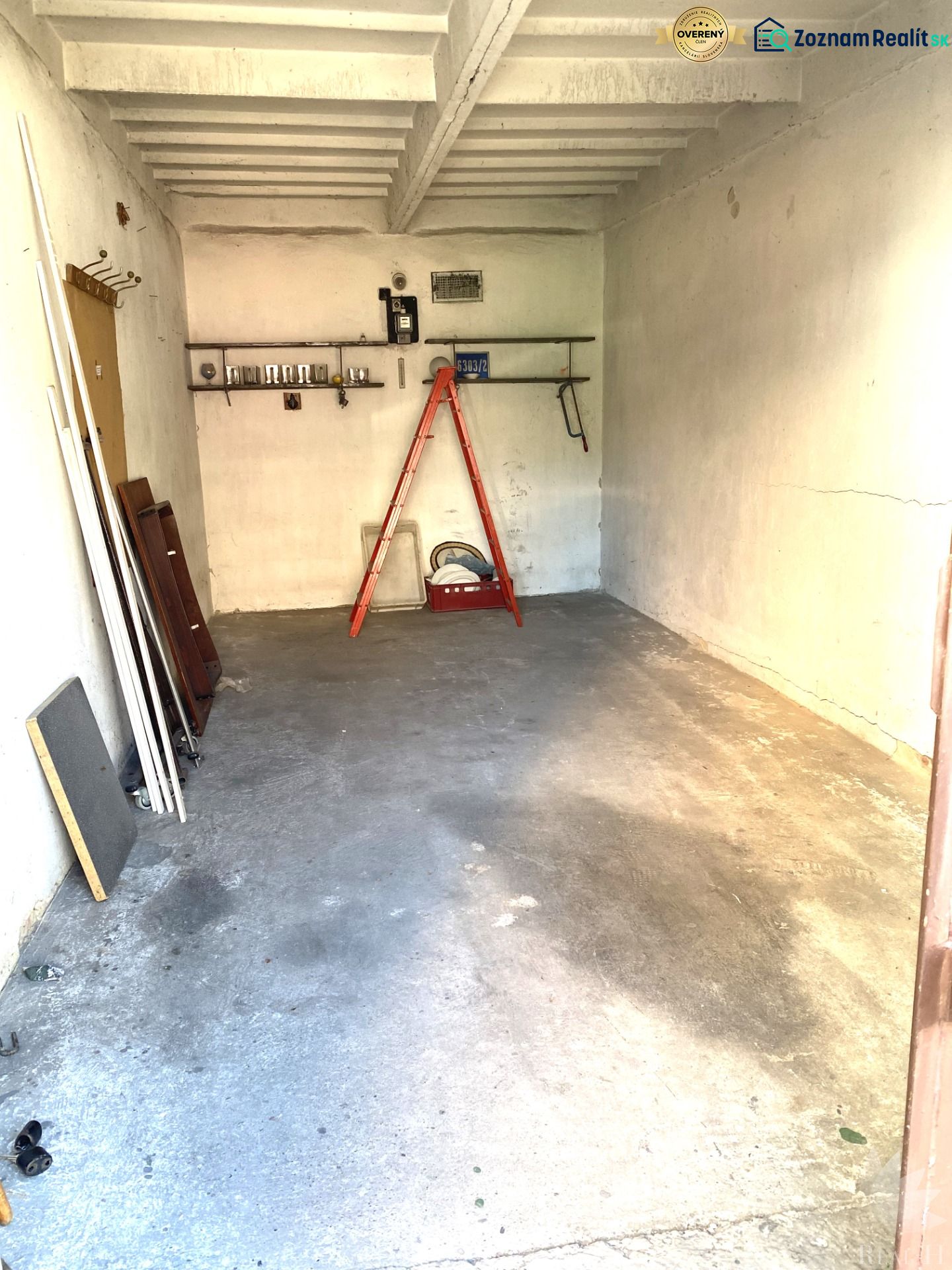 In the garage on Čmelíkova Street in Bratislava - Ružinov, there are stairs and a simple shelf.