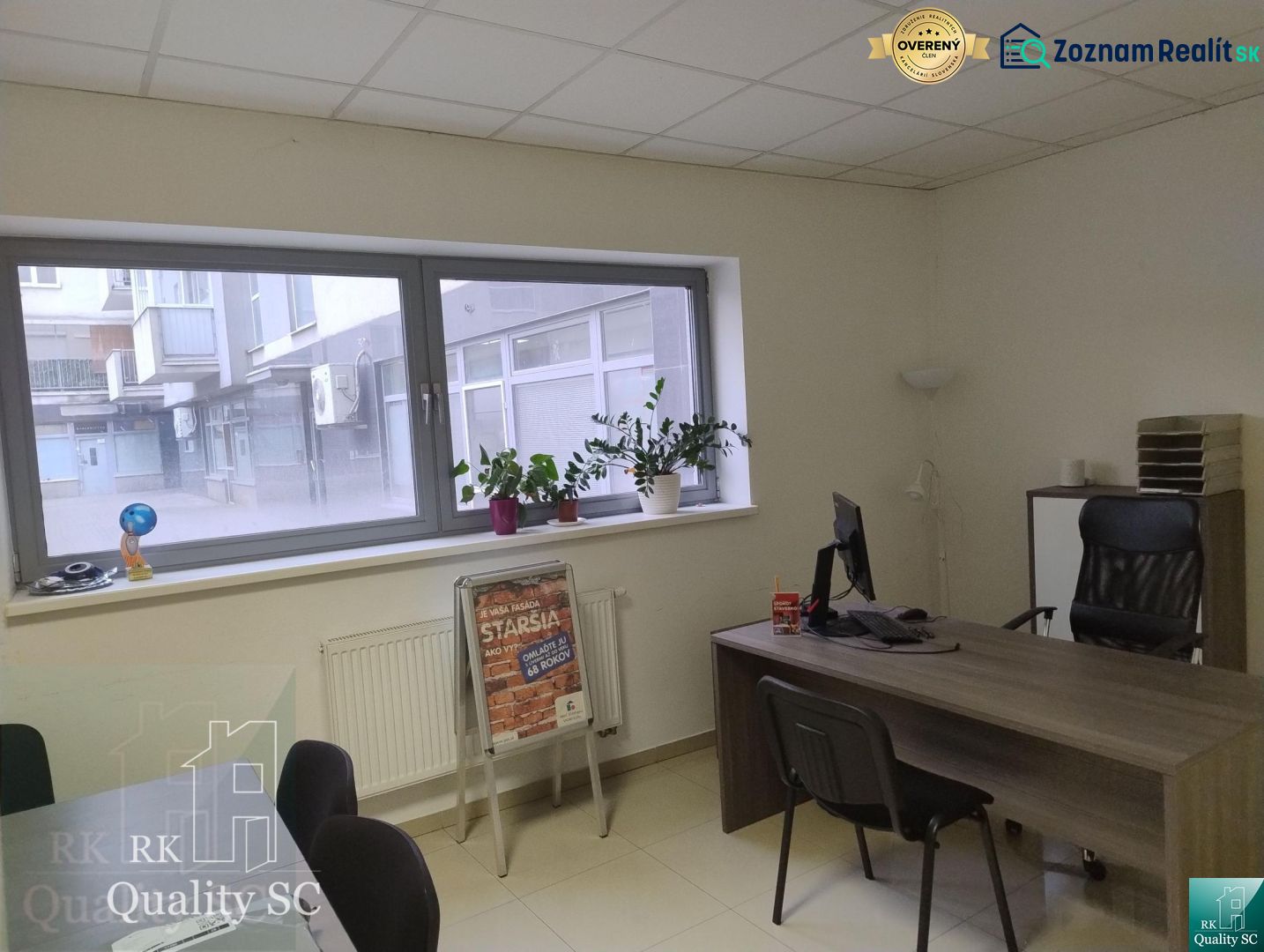 Offices with a desk, chairs, and plants on the windowsill in Senec.