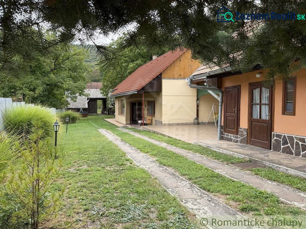 A family house in Silická Jablonica with a yard, garden, and terrace in a natural setting.