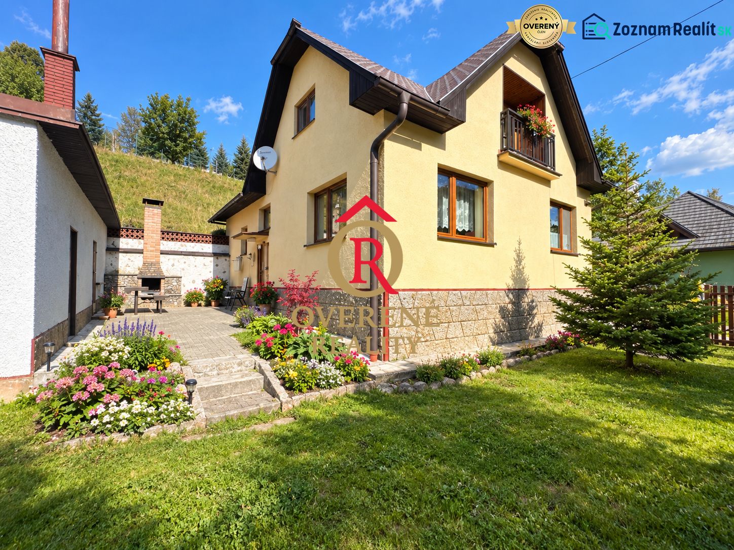 A family house in Liptovské Revúce with a stone staircase, a garden, and an outdoor fireplace.