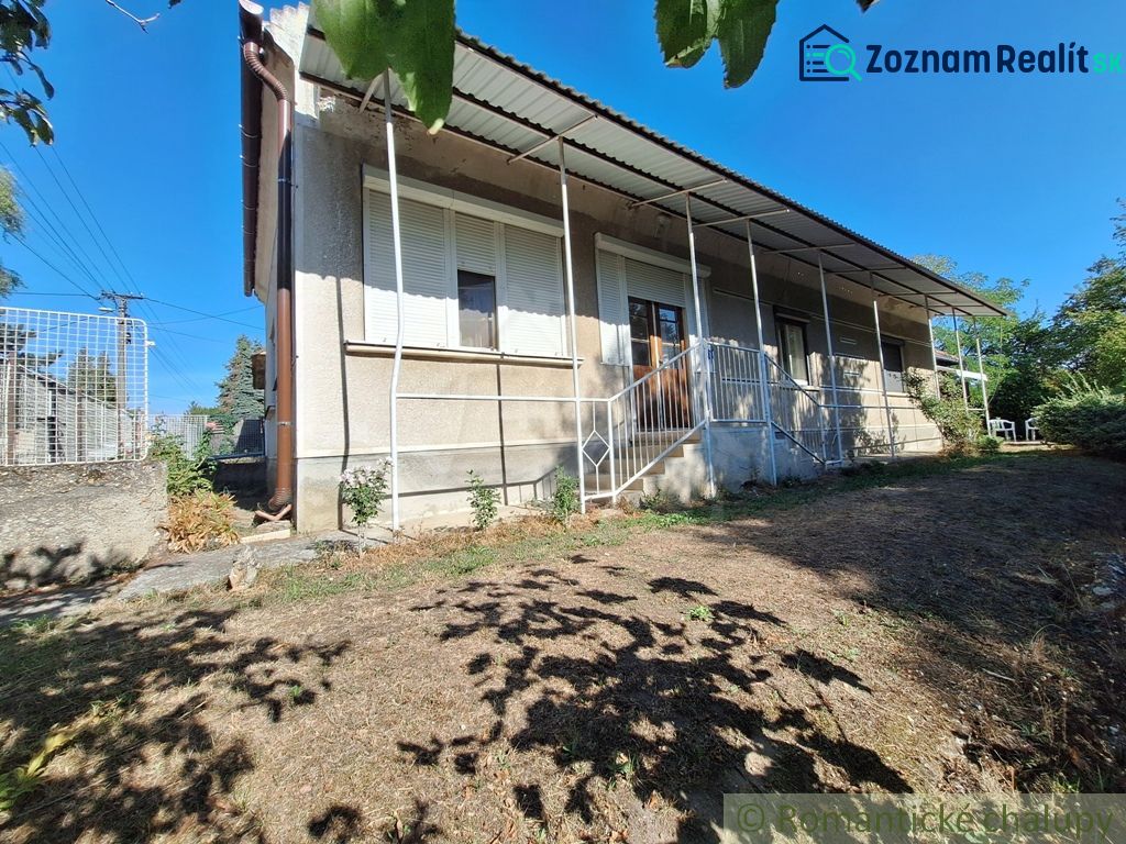 A family house in the village of Moča with a veranda and a garden.