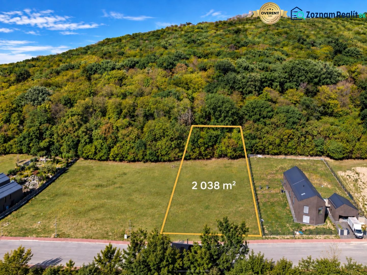 Development land in Borinka with an area of 2038 m², surrounded by greenery and hills.