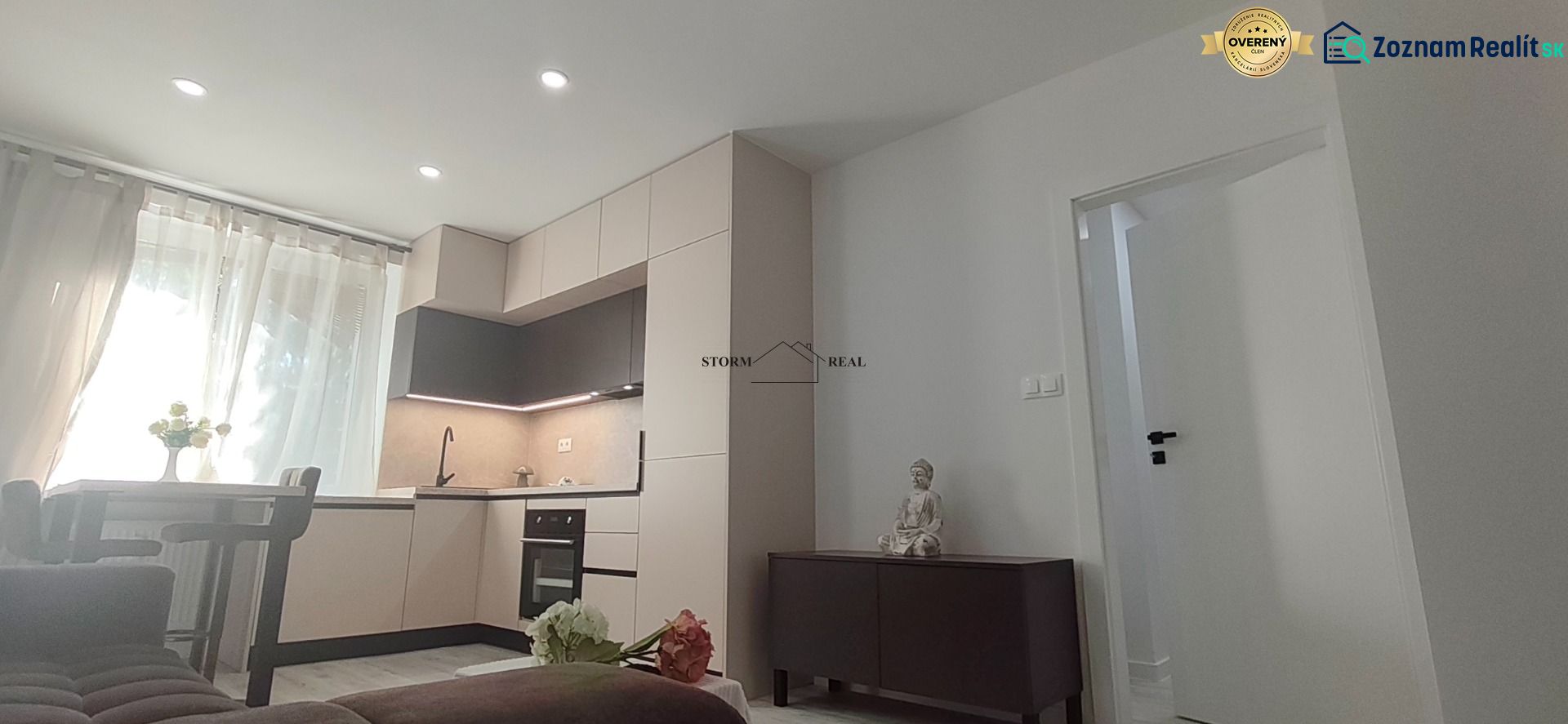 Kitchen with a kitchen unit, table, and decorative elements in a 3-room apartment.