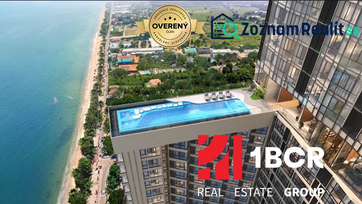Apartments construction in Pattaya with a swimming pool and a view of the sea and beach.