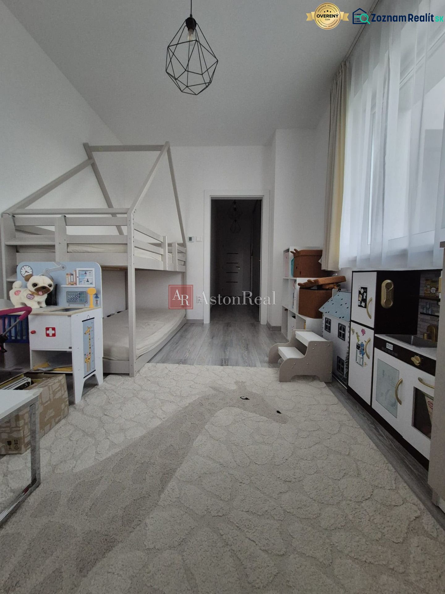 A children's room with a bunk bed and decorative lighting in a 3-room apartment.