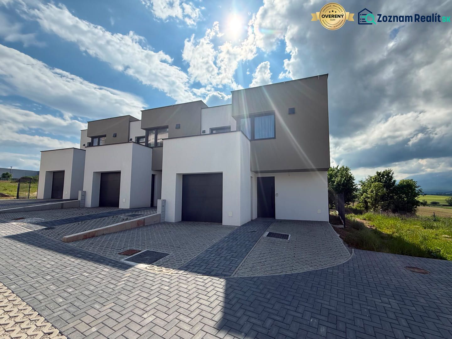 Poprad: Apartments and houses in Poprad in an environment with hills and open skies.