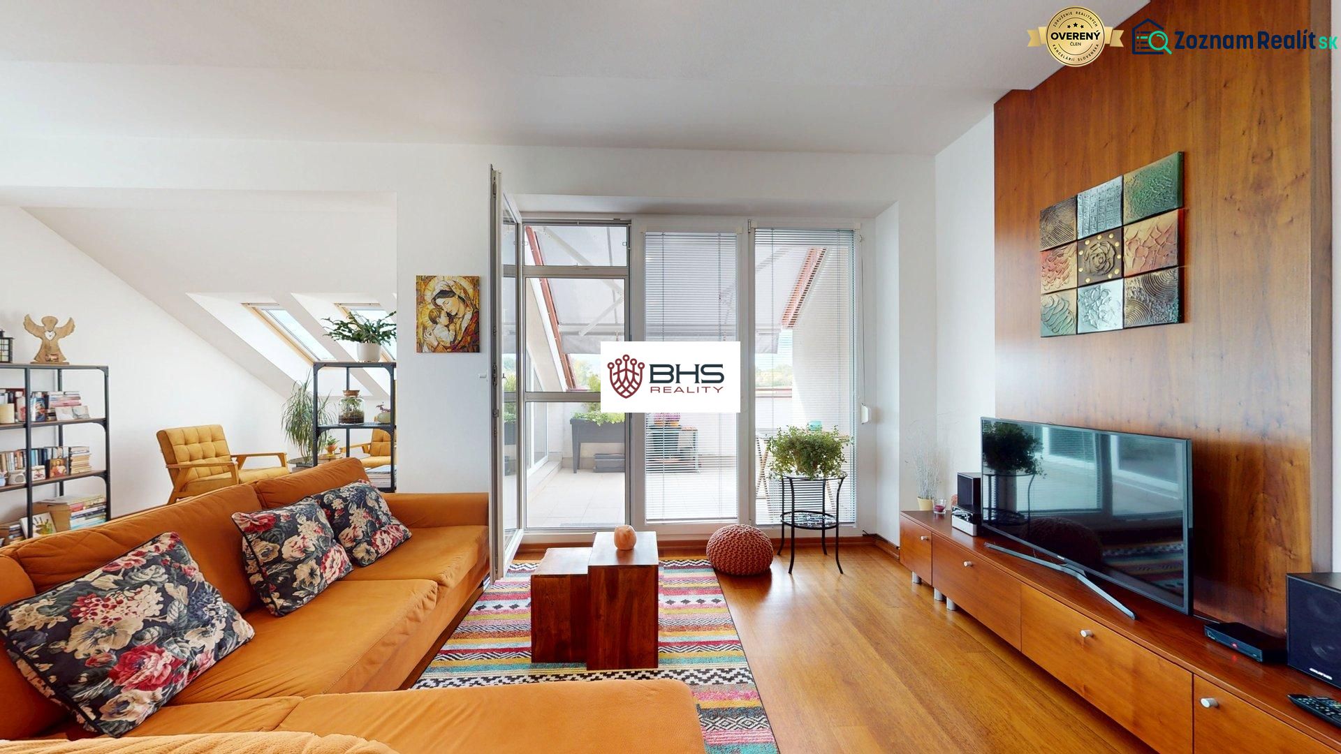 Living room with wood-patterned flooring and comfortable seating in a 4-room apartment.