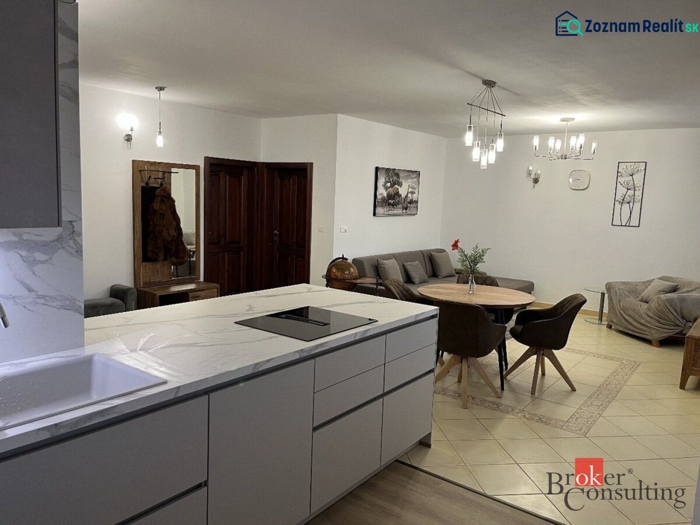 Kitchen and living room with a dining table in a 3-room apartment.
