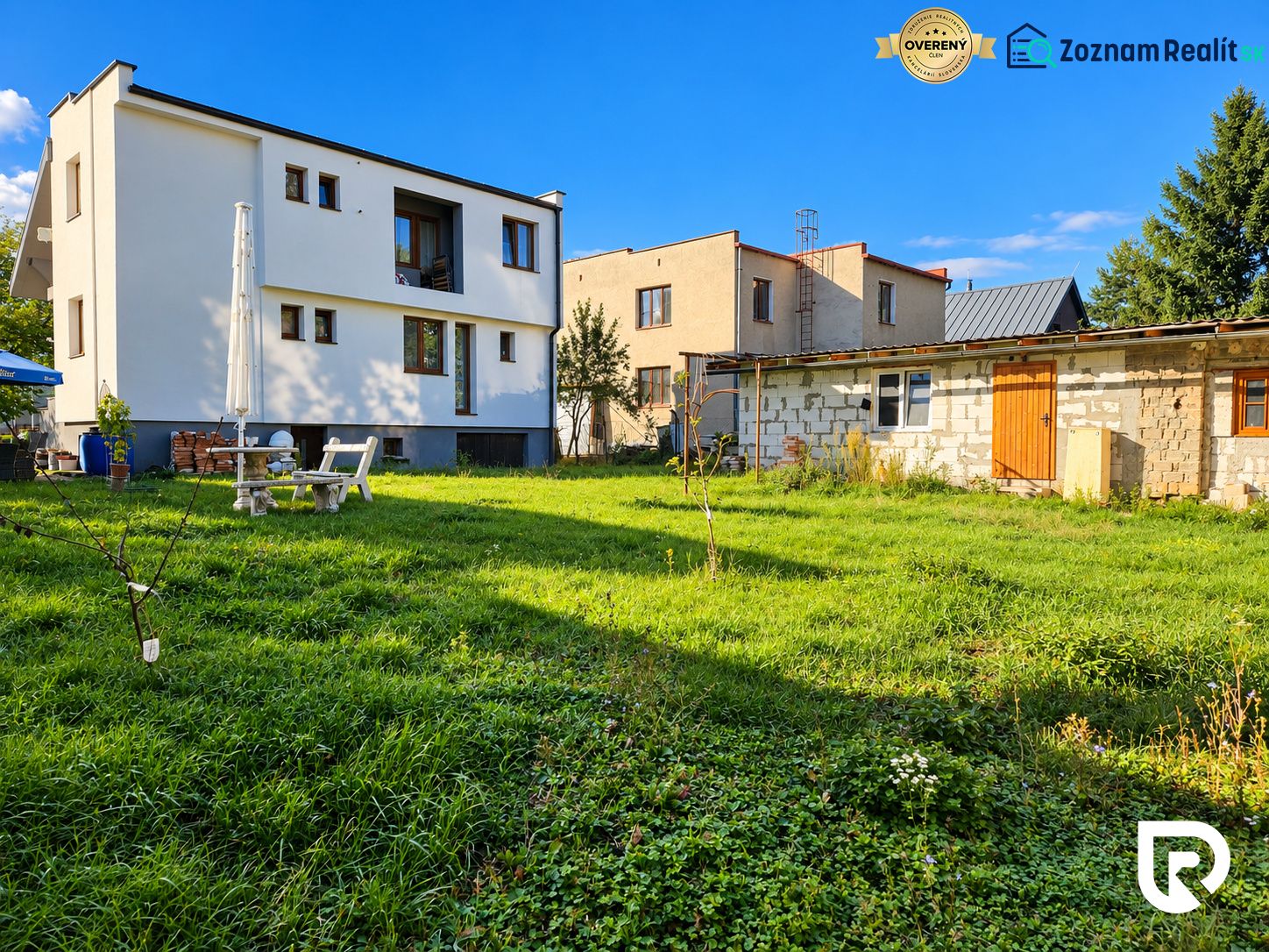 A family house in Martin with a garden, terrace, and an adjacent building on a spacious plot.