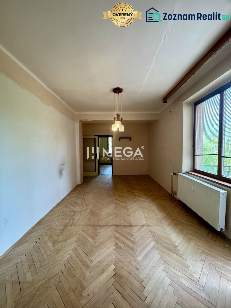 2-room apartment with wood-patterned flooring and pendant lighting.