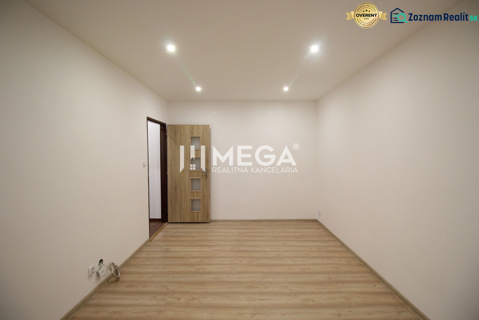 An empty room in a recreational apartment with wooden floor decor and light paint.