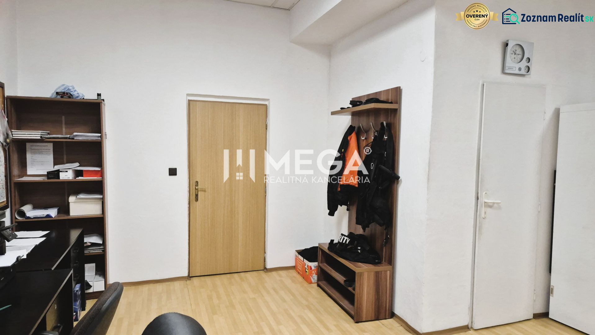 Offices with a shelf, a hanger, and a floor with a wooden decor.
