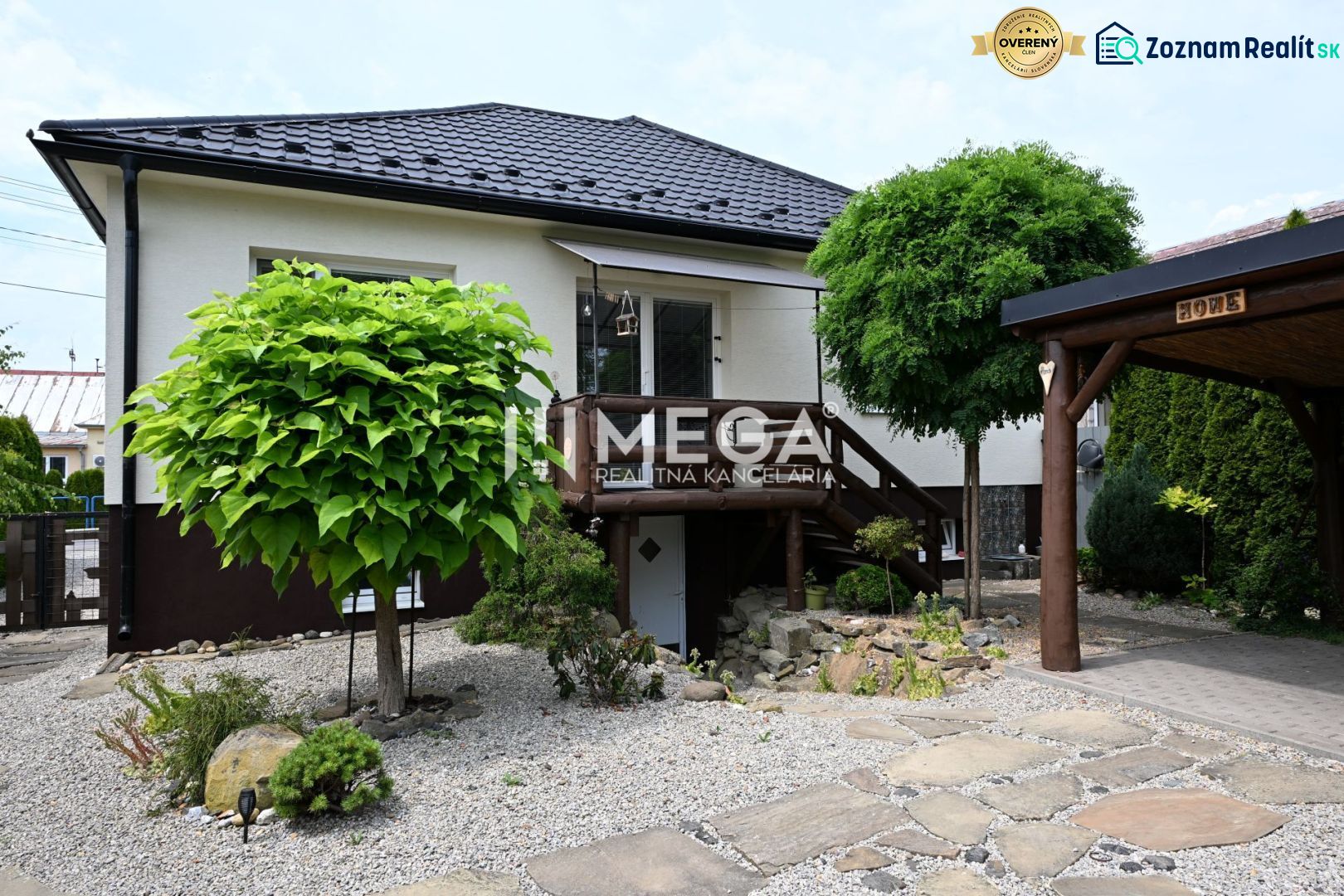 A family house in Udavské with a well-maintained garden and a stone driveway.