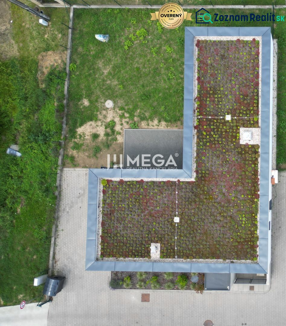 A family house on Gaštanová Street in Humenné with a green roof and a yard.
