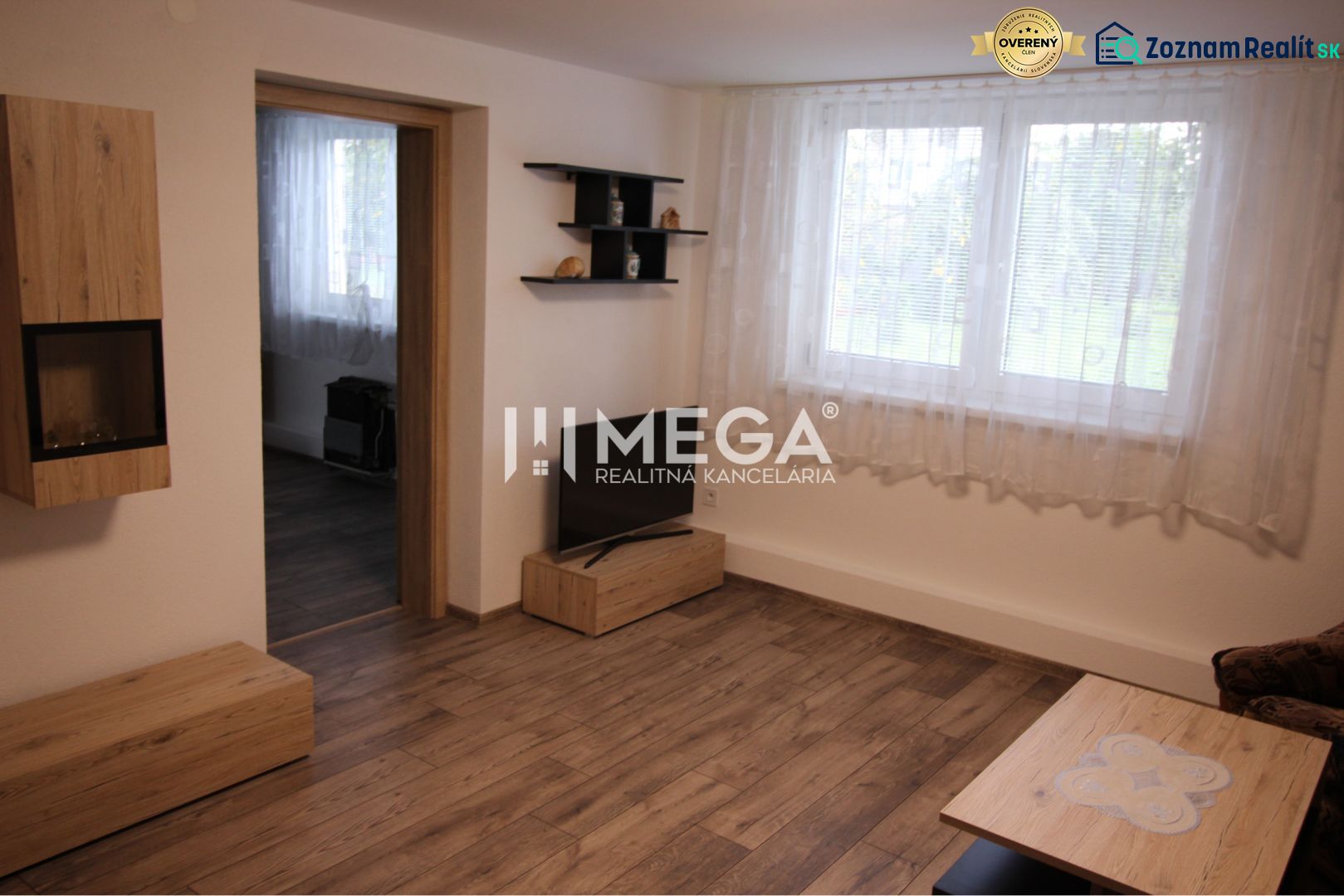 Living room in a family house with a wooden decor floor and furniture.