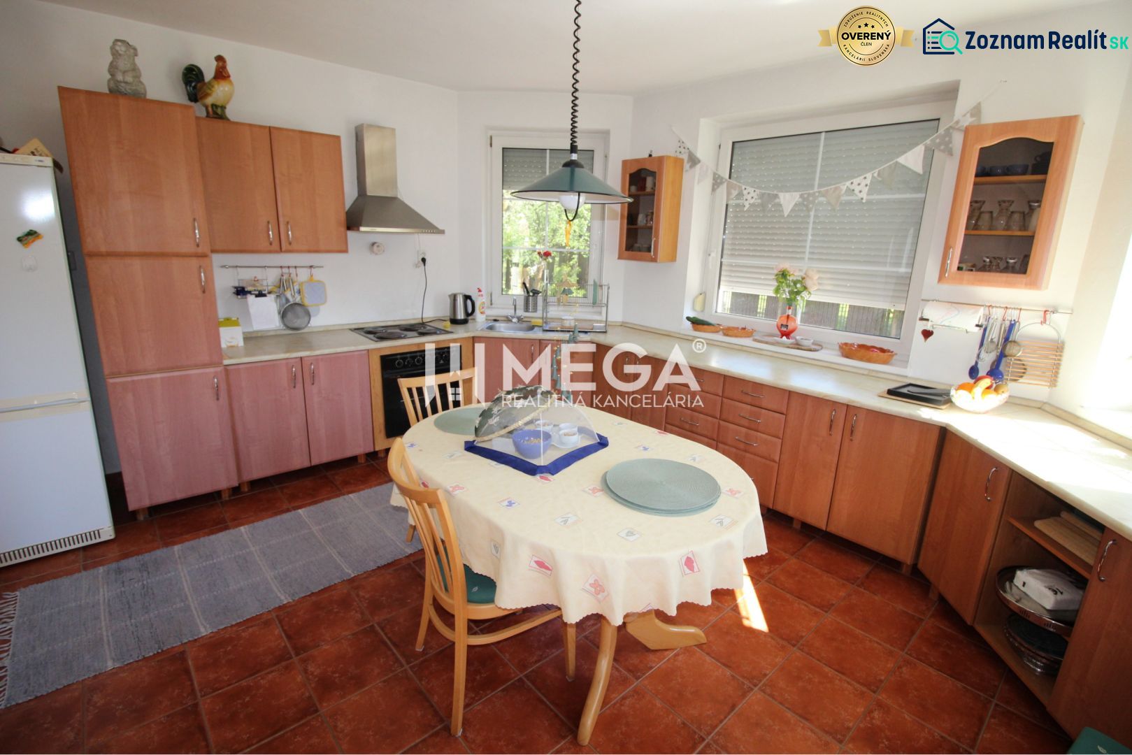 A kitchen in a family house with wooden decor and a dining table.