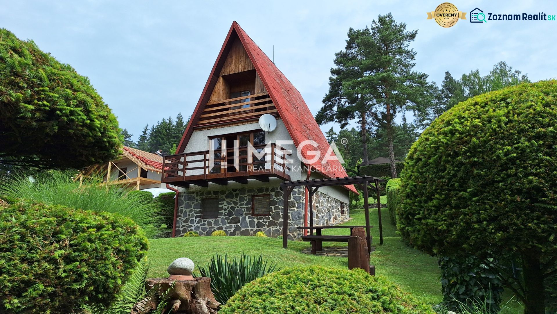 A cottage in Nová Kelča surrounded by a landscaped garden and greenery creates a pleasant rural environment.