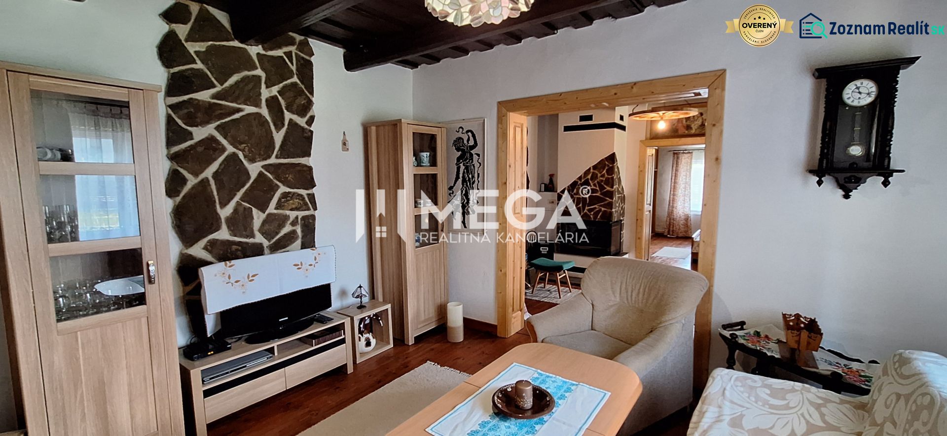 Living room in a family house with stone decoration and wooden decor flooring.