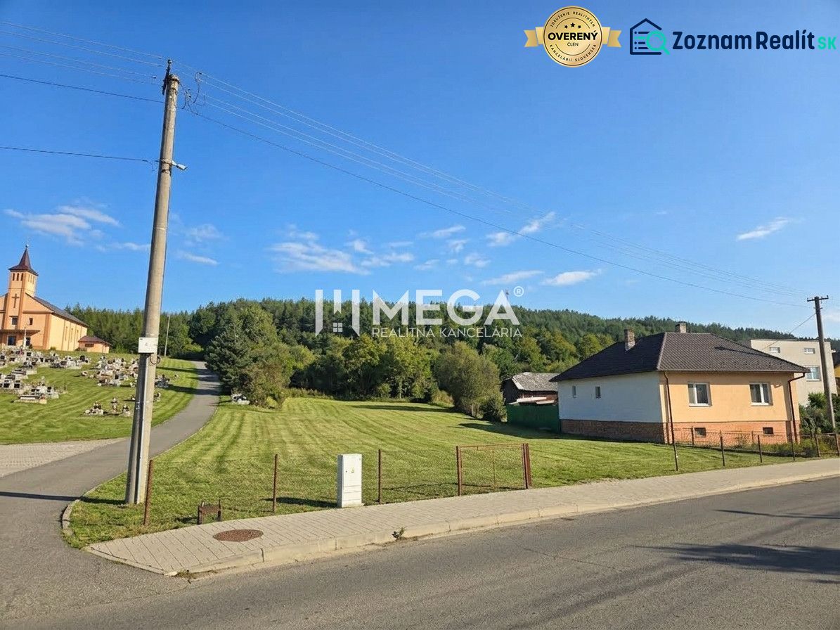 Lands - housing in the village of Slovenská Volová, grassy meadow near the church in a peaceful environment.