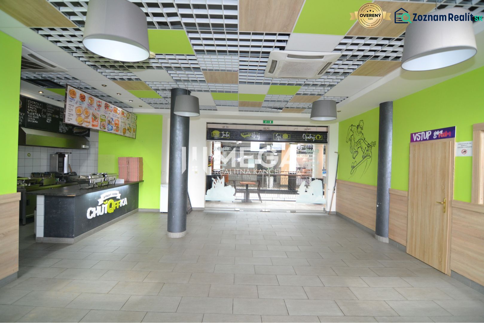 Commercial spaces with a dining counter, wooden decor flooring, colorful interior elements.