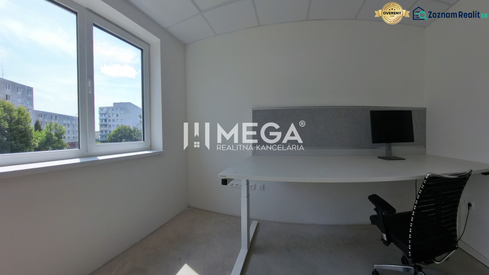 Office space with a desk, chair, and computer, view of Laborecká Street.