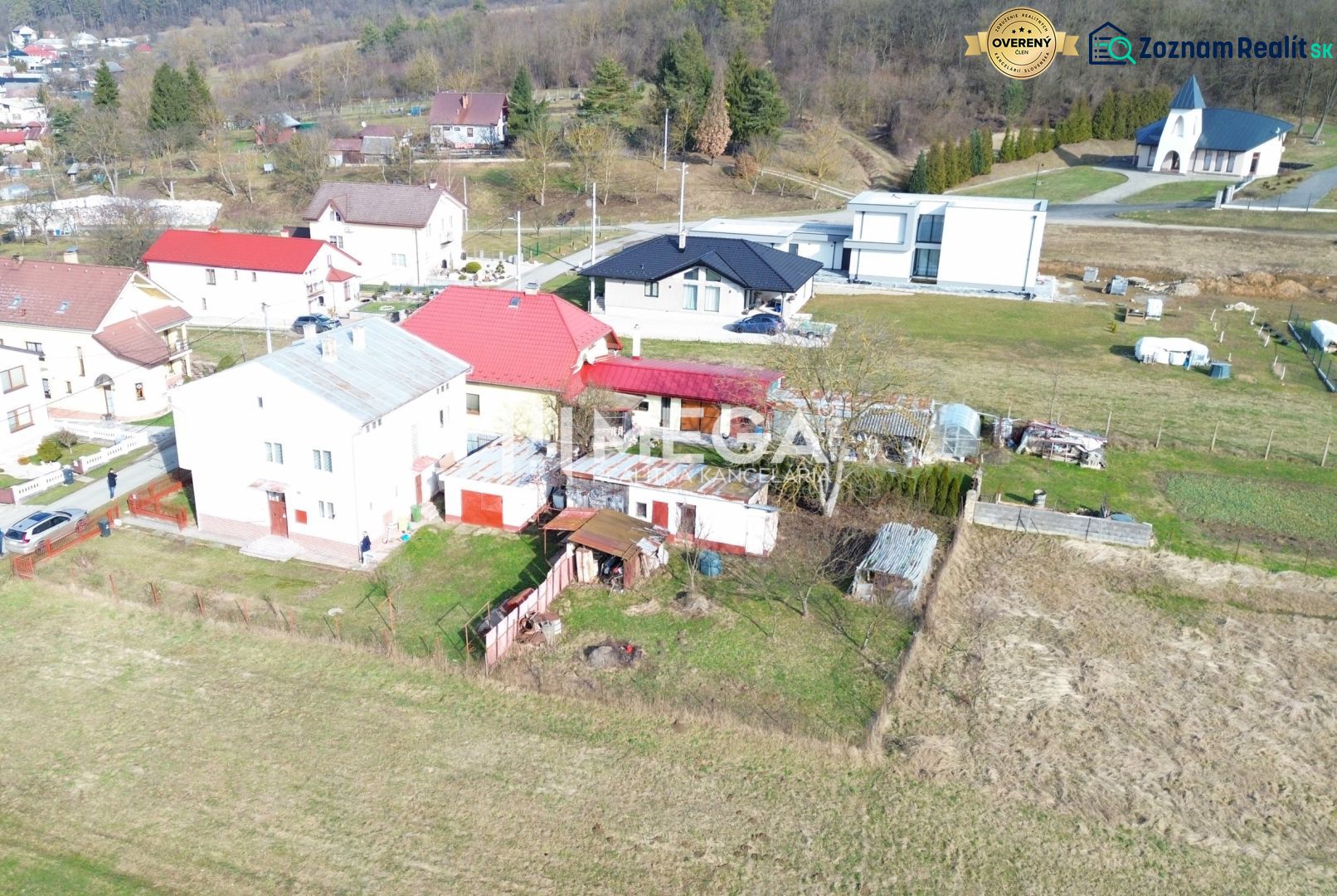 A family house in the village of Myslina on Myslina Street with a rural surroundings and a garden.