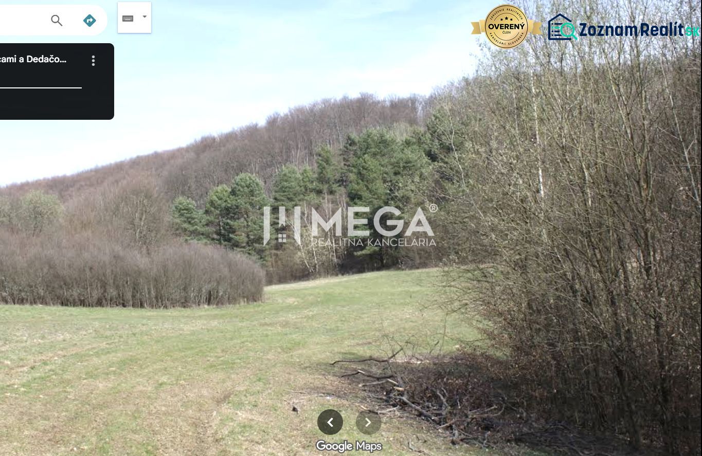 Agricultural and forest land in Maškovce with a view of wooded hills.