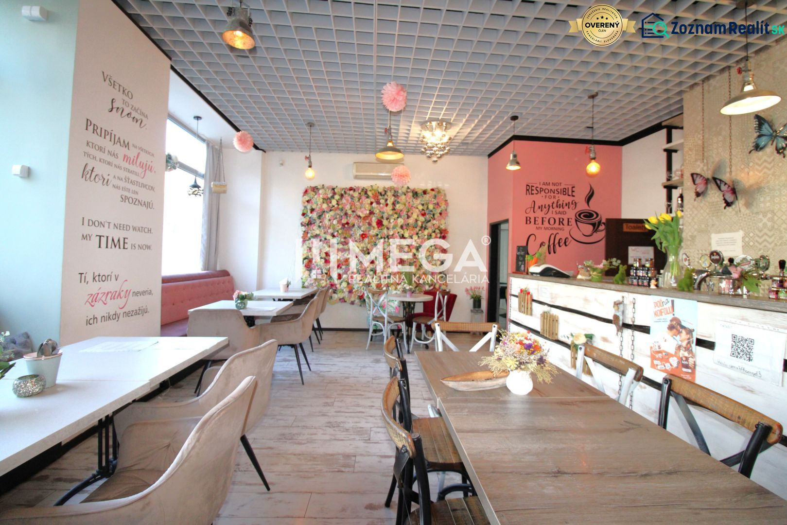 Interior of gastro spaces with decorative walls, flowers, and comfortable seating.