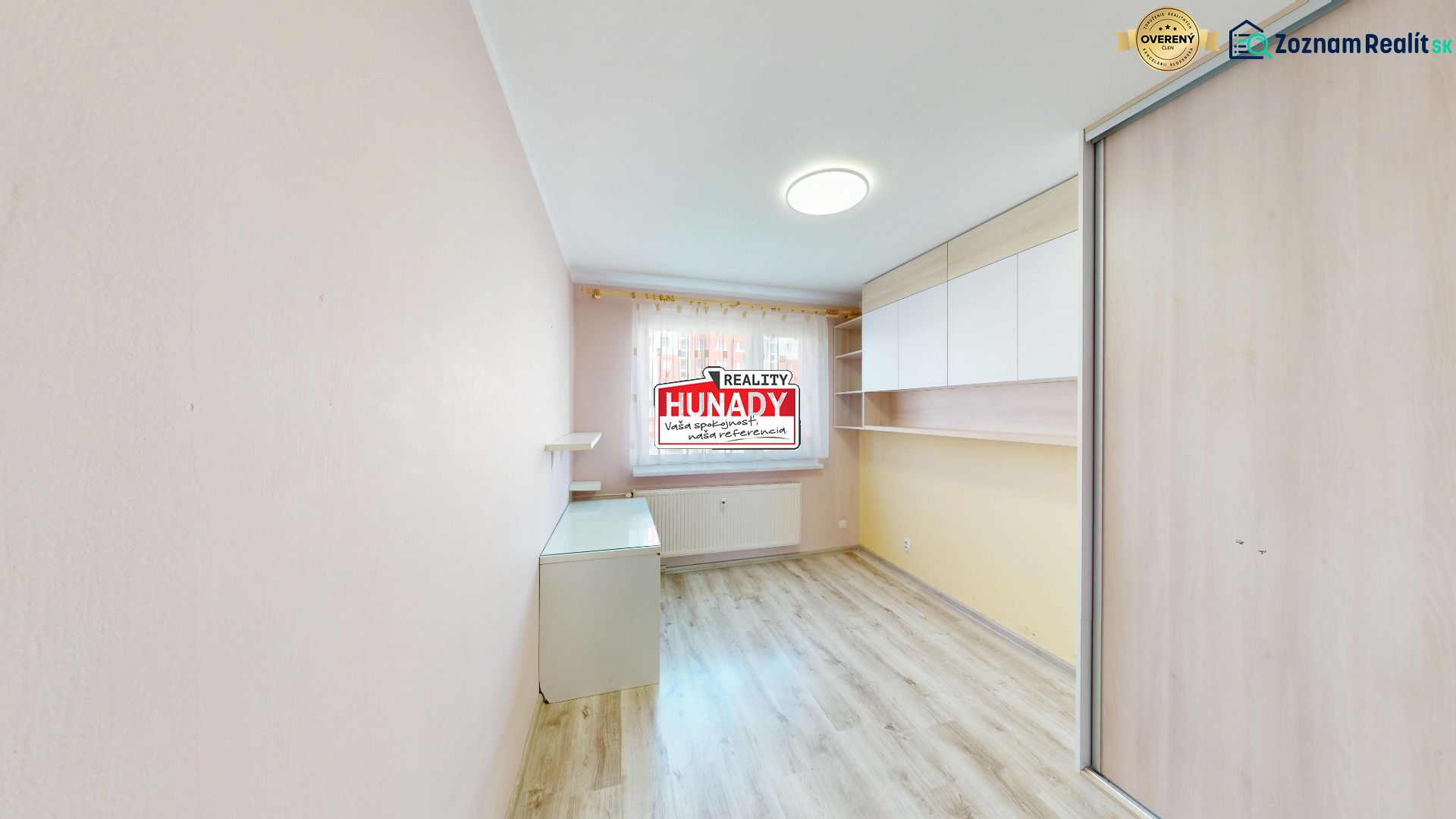 A room with a wooden decor floor and storage spaces, 3-room apartment.