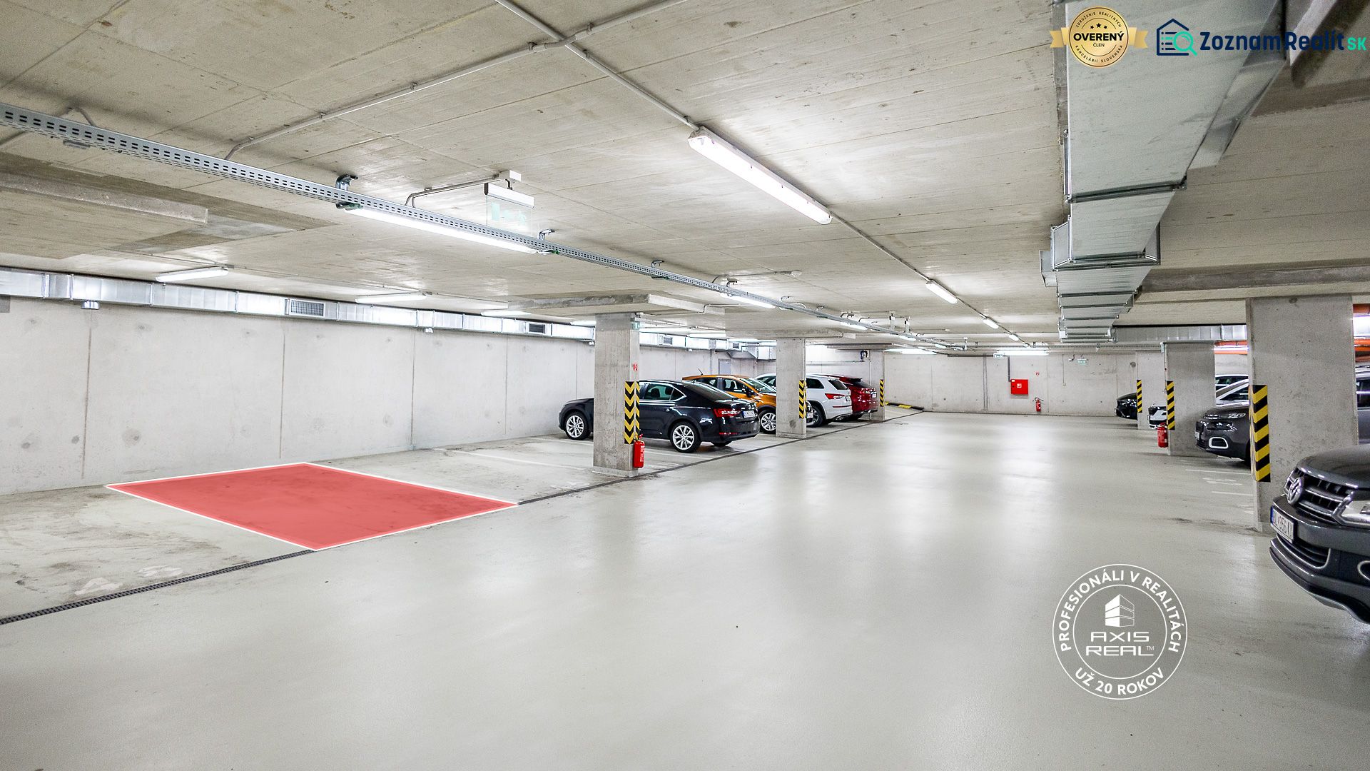 Underground garages with parking spaces and concrete pillars.
