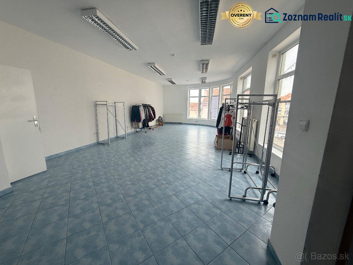 Retail spaces with blue tiles and clothing racks.