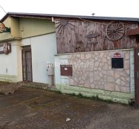 A building of commercial premises in the village of Váhovce on Hlavná Street.