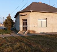 Commercial premises on Hlavná Street in Váhovce, a corner building with two windows and an entrance.