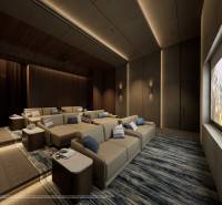 Indoor cinema with comfortable seats and a large screen, Apartment construction.