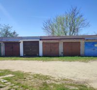 Garages on Veterná Street in Holíč with closed double-wing doors.