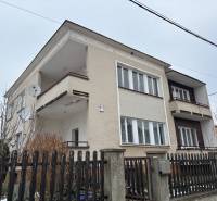 A family house in Trenčín in Zamarovce with balconies and a pallet fence.