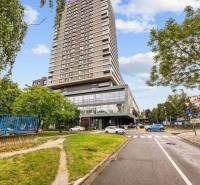 A tall building surrounded by greenery on Nevädzova Street in Bratislava - Ružinov.
